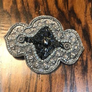 Silver belt buckle with stones and faux diamonds